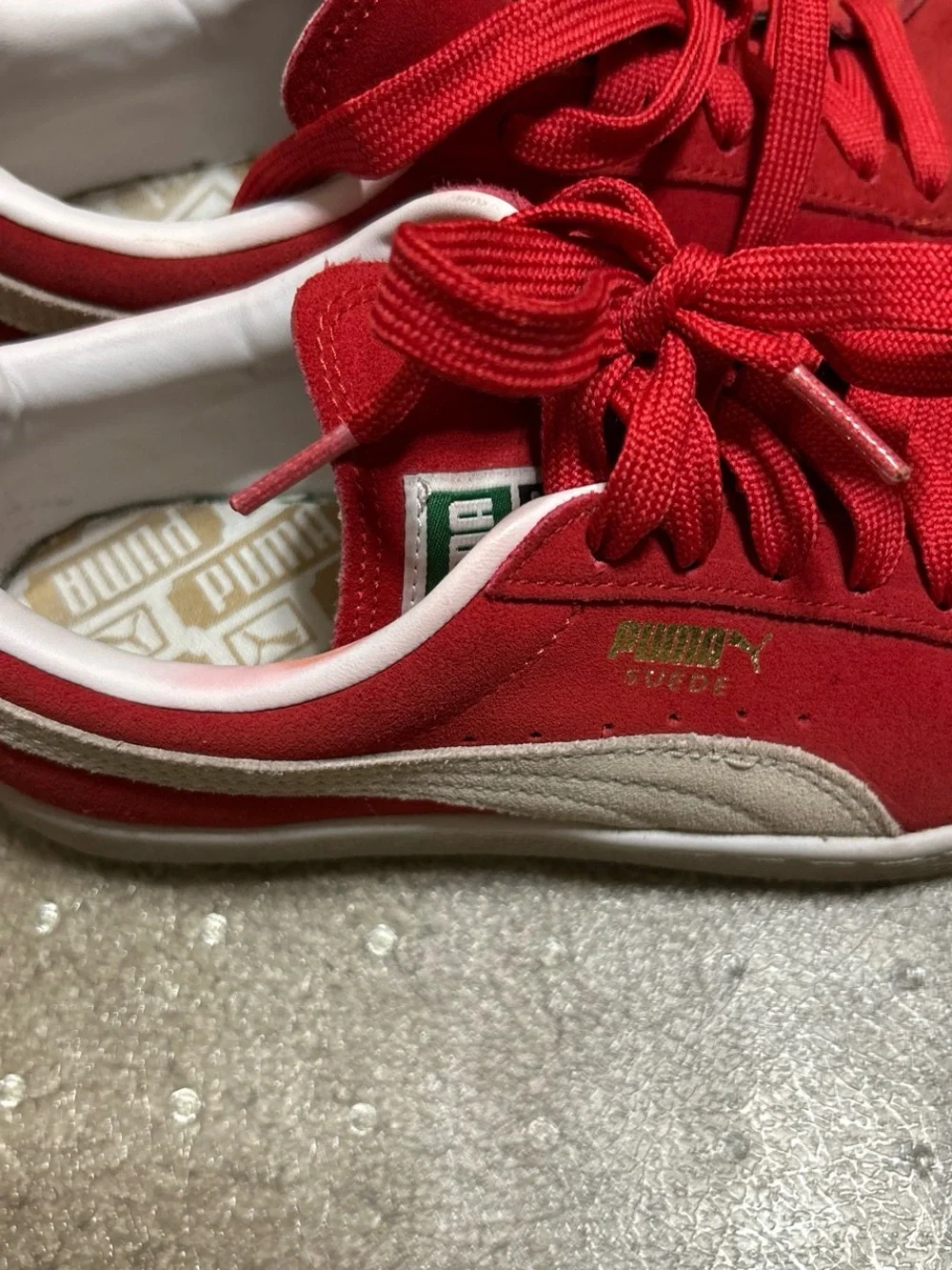 Puma Red and White Low-Top Sneakers with Gold Logo Accent